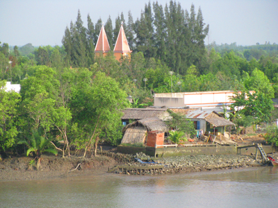 House and Church On Mekong Delta